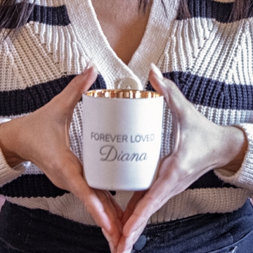 Celebrate Special Occasions – Forever Loved Custom Candle The Forever Loved Custom Engraved Candle placed on a mantel, radiating comforting vanilla and woody undertones for weddings or anniversaries.