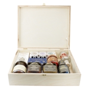 Open wooden gift box by Elenianna containing authentic Greek products: Navarino Icons extra virgin olive oil, Mouriki honey, Cretan Tsikoudia spirit, Kalamon olives, and gourmet preserves against a white background.