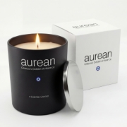 Aurean Nox Dark Honey and Tobacco scented candle displayed next to its premium white branded packaging box on a clean white background.